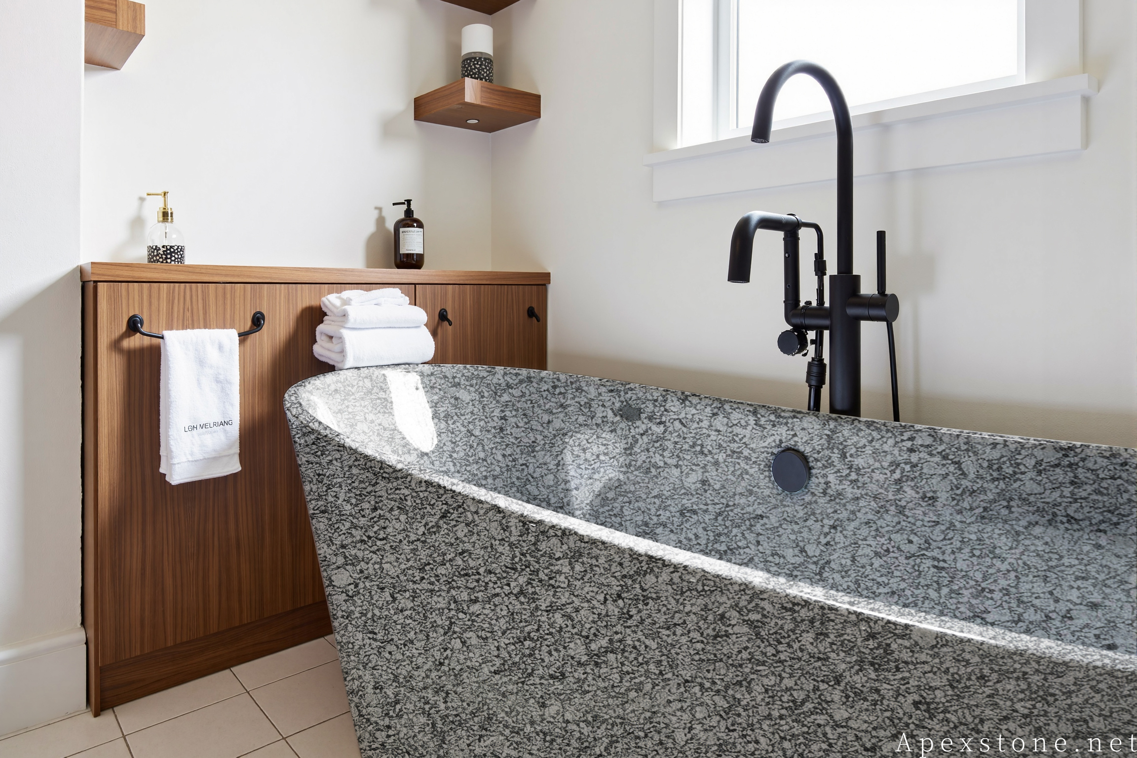 Sea Wave Granite - bathtubs Freestanding carved Sea Wave granite bathtub in a bright bathroom