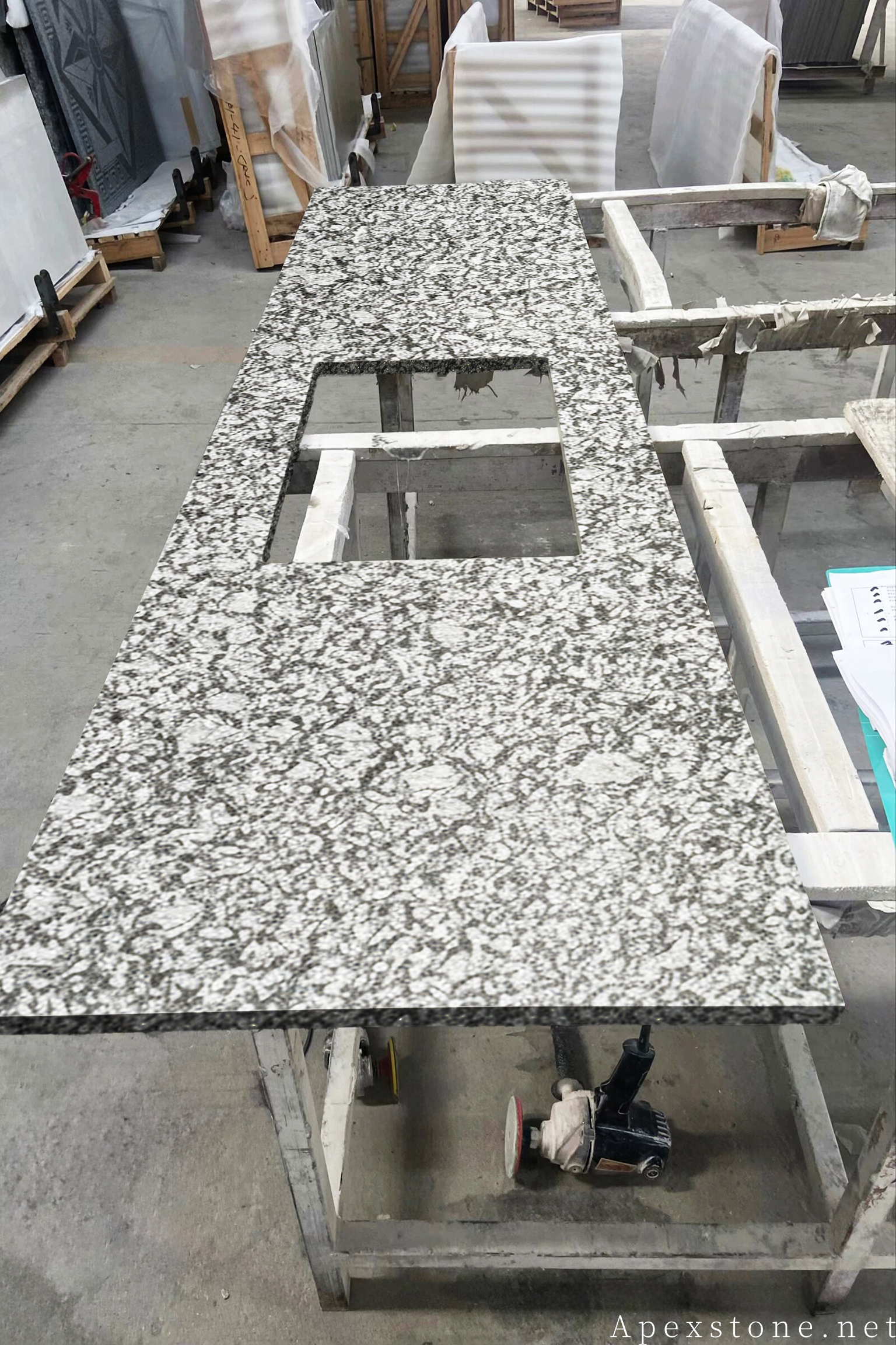 Custom Sea Wave granite countertop with sink cutout in the workshop