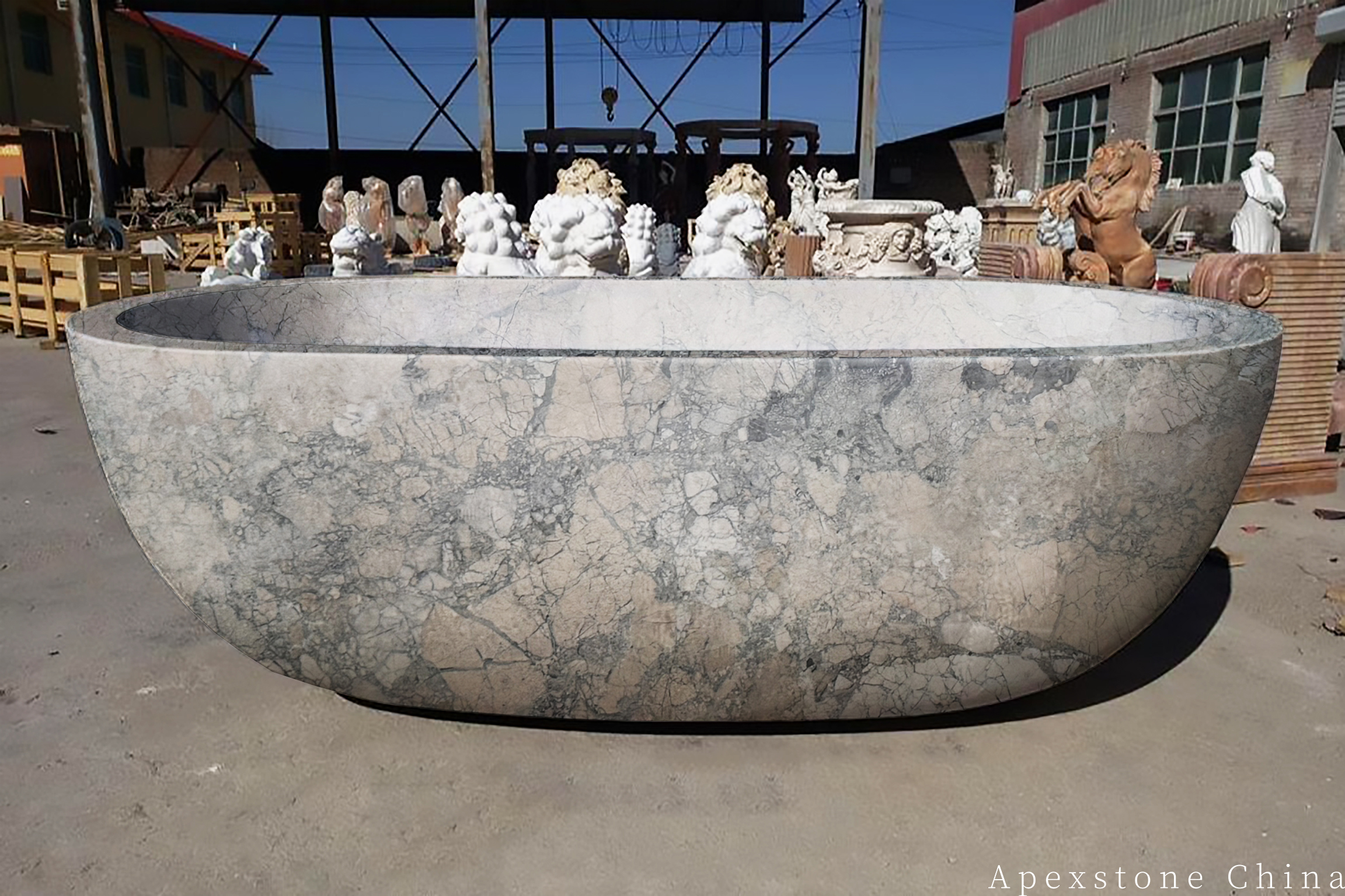 Solid stone bathtub carved from Monet Impression marble in a bathroom