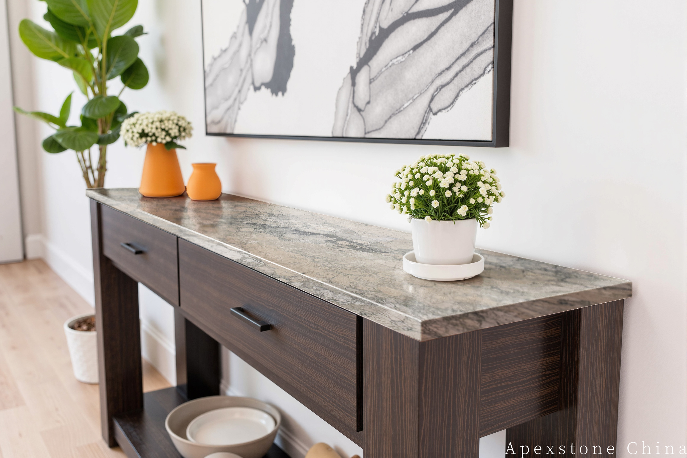 Monet Impression marble console table against a warm wood entry wall