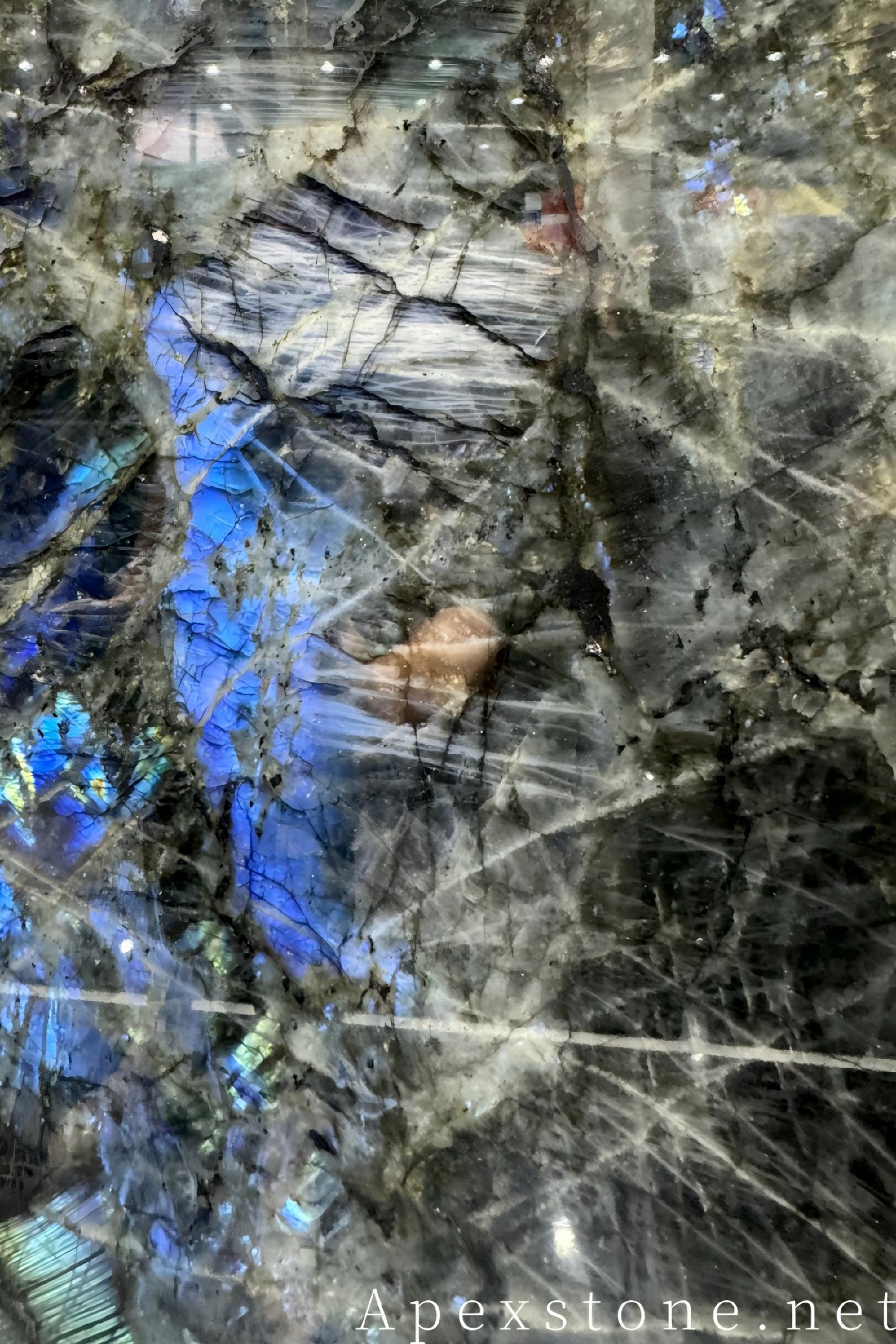 Blue Emerald labradorite slabs with deep blue-green flashes over a dark ground
