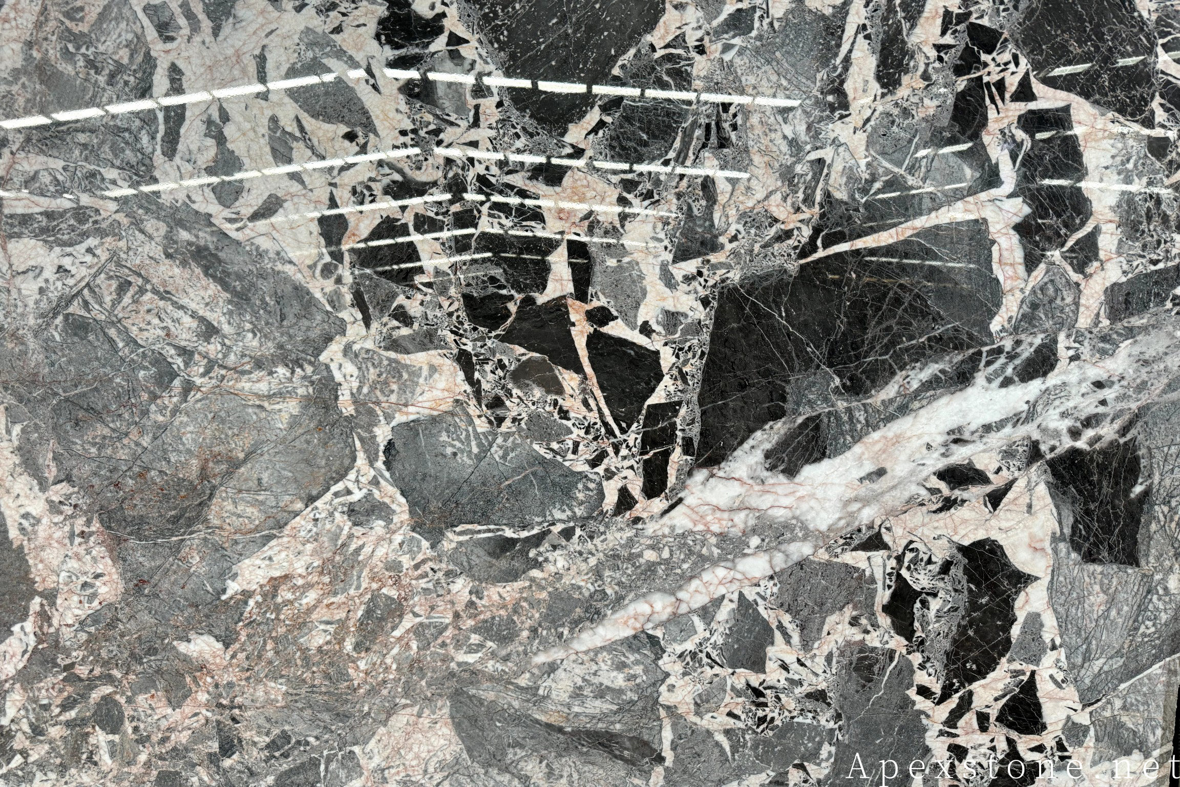 Chanel Grey marble with pale grey ground crossed by fine crystalline veins